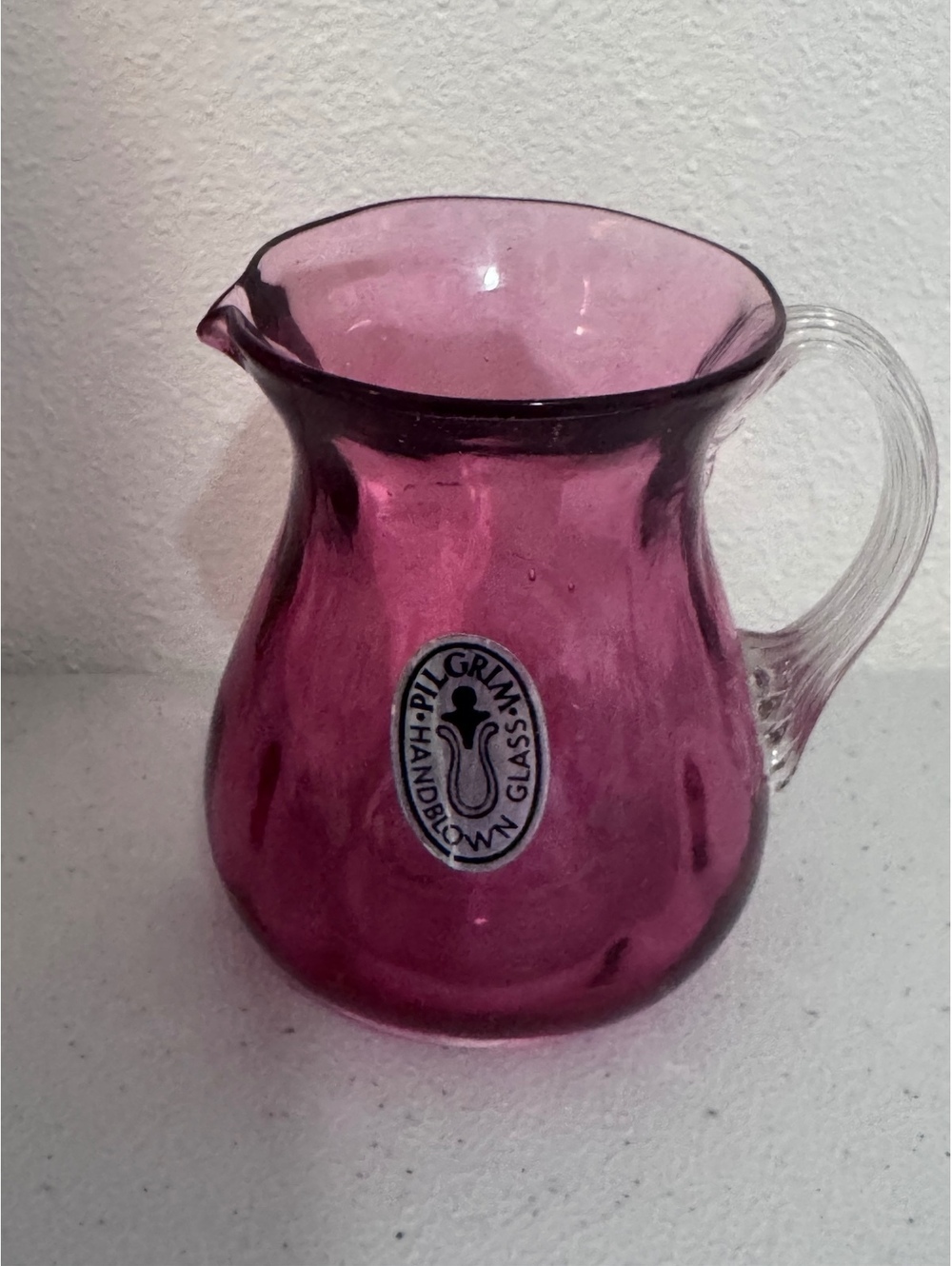 Pilgrim Handblown Glass Purple Pitcher with Clear Handle